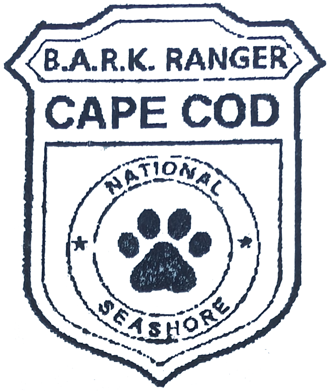 Black inked shield stamp for the BARK Ranger program at Cape Cod National Seashore Black inked shield stamp for the BARK Ranger program at Cape Cod National Seashore