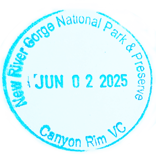 Blue circular inked stamp for New River Gorge National Park and Preserve - Canyon Rim Visitor Center
