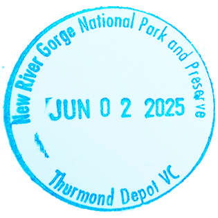 Blue circular inked stamp for New River Gorge National Park and Preserve - Thurmond Depot Visitor Center
